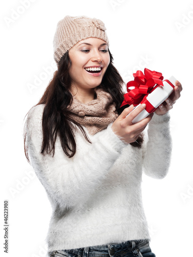 Photo: Pretty young Woman pleased with a gift Pretty young Woman pleased with a gift