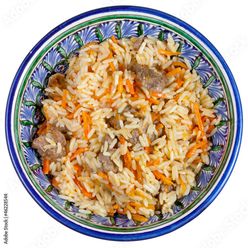 Photo: top view on traditional asian pilau with meat top view on traditional asian pilau with meat