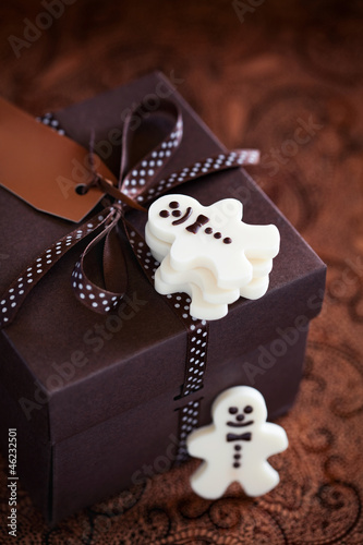 Photo: White chocolate christmas candy man and gift box White chocolate christmas candy man and gift box