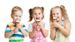 happy children boy and girls eating ice cream in studio isolated
