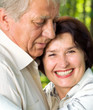 Senior happy couple embracing, outdoors