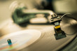 tonearm on vinyl disc