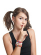 Attractive teen girl in black top with pigtails play