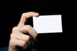 Man holding business card. Close up shot