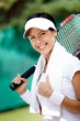 Young female tennis player with towel 