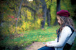 Photo: teen girl alone with cell phone in autumn setting teen girl alone with cell phone in autumn setting
