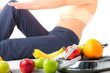 Diet and sport - young woman is doing sit-ups