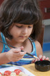 girl painting martorana fruit