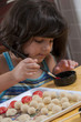 girl painting the martorana fruit