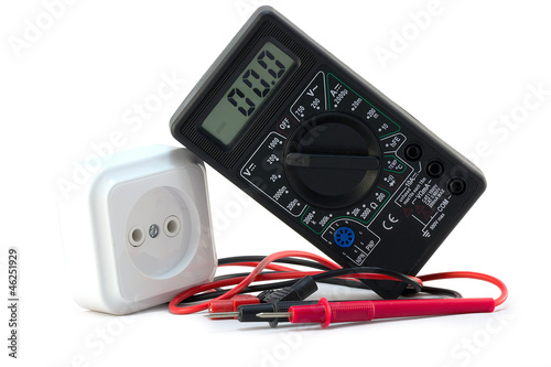 Photo: multimeter with electrical outlet on a white background multimeter with electrical outlet on a white background