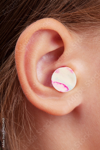 Photo: Ear plugs in the human ear Ear plugs in the human ear