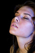 Foto: The wet girl with the spread cosmetics on the black The wet girl with the spread cosmetics on the black