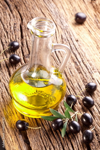 Photo: Ripe black olives with leaves. Ripe black olives with leaves.