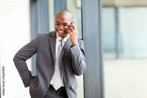 Photo: african american businessman talking on mobile phone african american businessman talking on mobile phone