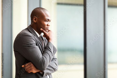 Photo: thoughtful african american businessman in office thoughtful african american businessman in office