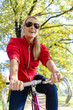 Happy woman cycling on bicycle
