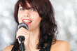 Foto: Beautiful singer with microphone Beautiful singer with microphone