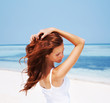 Beautiful young female model at the beach