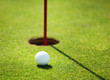 golf ball on lip of cup