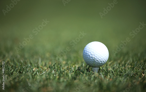 Photo: golf ball on green golf ball on green