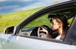 girl with glasses while driving