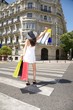 happy walking with shopping bags on crosswalk
