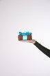 Photo: isolated brown present on woman arm isolated brown present on woman arm