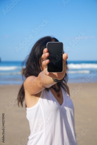 Photo: woman with blank screen mobile woman with blank screen mobile