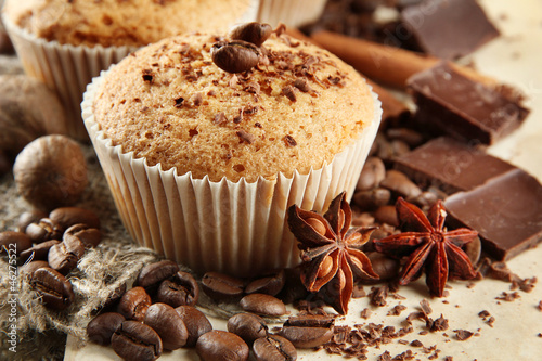 Photo: tasty muffin cakes with chocolate, spices and coffee seeds, tasty muffin cakes with chocolate, spices and coffee seeds,