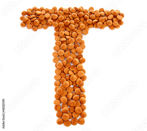 Photo: Ginger nuts, pepernoten, in the shape of letter T Ginger nuts, pepernoten, in the shape of letter T