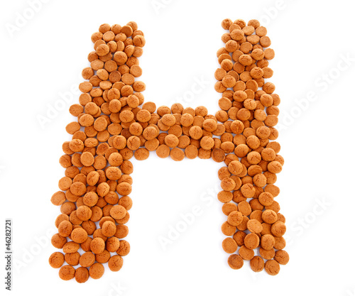 Photo: Ginger nuts, pepernoten, in the shape of letter H Ginger nuts, pepernoten, in the shape of letter H