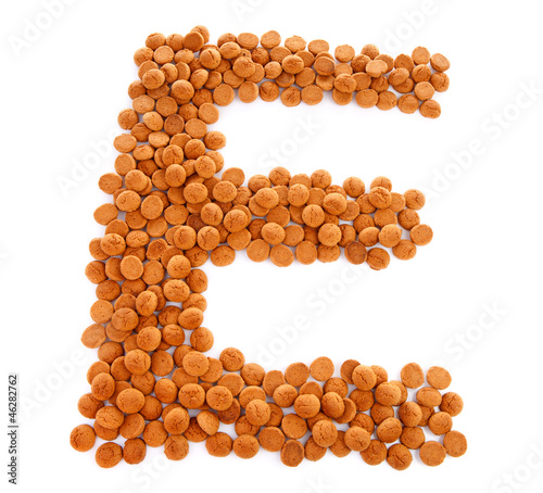 Photo: Ginger nuts, pepernoten, in the shape of letter E Ginger nuts, pepernoten, in the shape of letter E