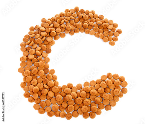 Photo: Ginger nuts, pepernoten, in the shape of letter C Ginger nuts, pepernoten, in the shape of letter C