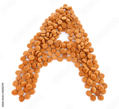 Photo: Ginger nuts, pepernoten, in the shape of letter A Ginger nuts, pepernoten, in the shape of letter A