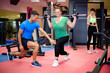 Photo: Individual training. Plus sized woman working out with personal Individual training. Plus sized woman working out with personal
