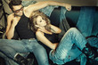 Sexy man and woman dressed in jeans doing a fashion photo shoot