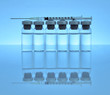 Vials of medications with syringe and needle.
