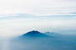 Volcano top under sky, bird's eye view.