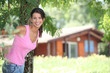 Brunette woman in front of chalet