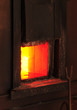 Open iron stove in boiler room