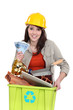 A tradeswoman holding a recycling bin and a wad of cash