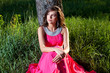 Foto: Woman in a long pink dress Woman in a long pink dress