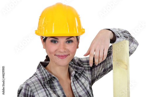 Photo: A female carpenter. A female carpenter.