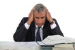 Businessman hitting the books