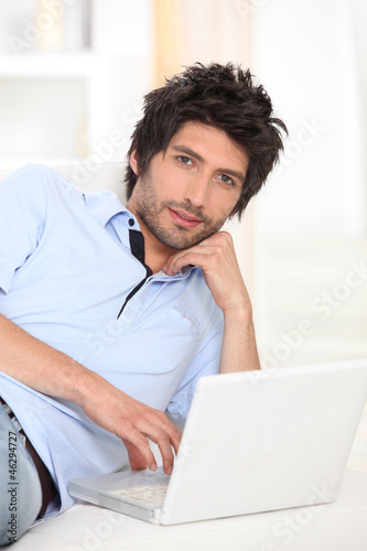 Photo: Man relaxing on the sofa Man relaxing on the sofa