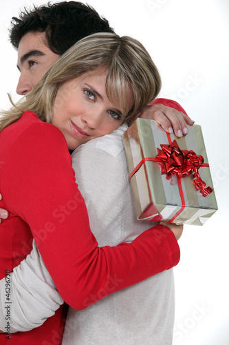 Photo: Woman thanking her boyfriend for his gift Woman thanking her boyfriend for his gift