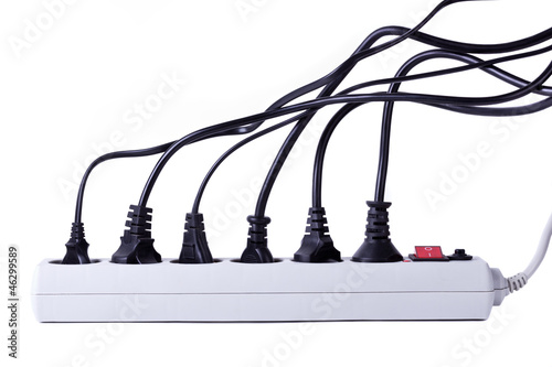 Photo: Many plugs plugged into electric power bar Many plugs plugged into electric power bar