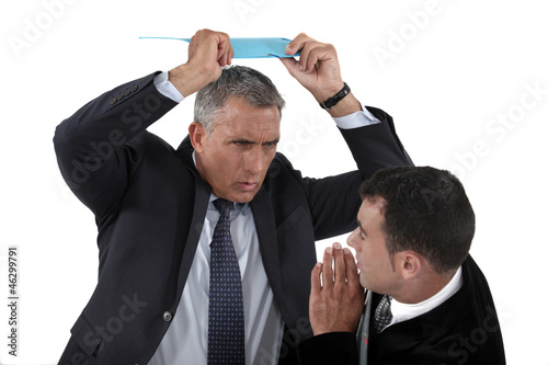 Photo: Angry boss hitting employee Angry boss hitting employee