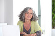 Photo: Woman in front of her laptop Woman in front of her laptop