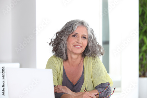 Photo: Woman in front of her laptop Woman in front of her laptop